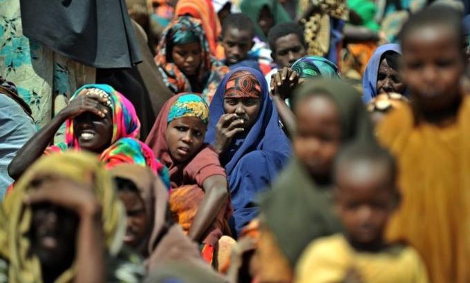 Newly arrived Somali refugees wait outsi