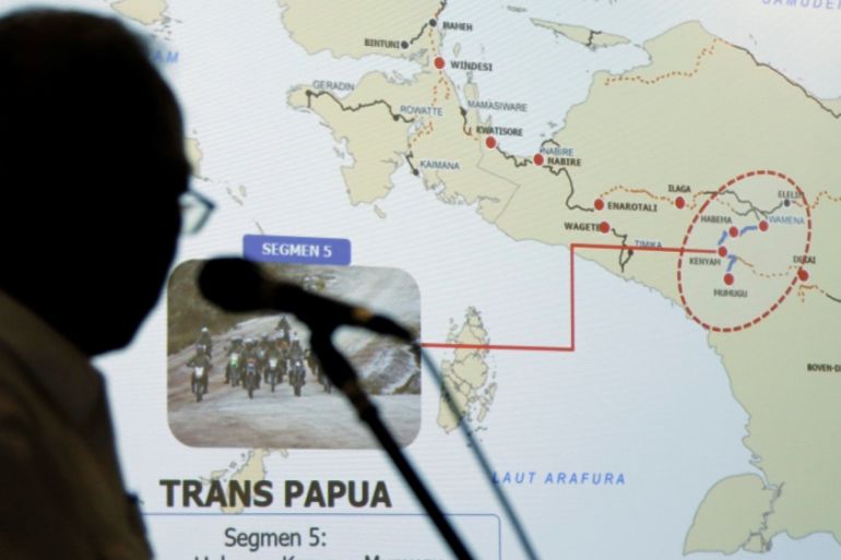 Indonesia''s Minister of Public Works and Public Housing Basuki Hadimuljono shows a Trans Papua map during a news conference in Jakarta