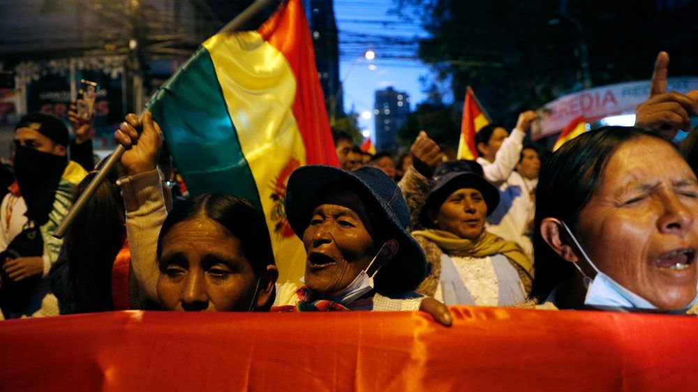 Opposition supporters protesting outside the top electoral court waiting for the final results of the presidential election in La Paz, Bolivia