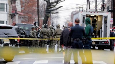 New York City Police officers on the scene of a shooting in Jersey City, New Jersey