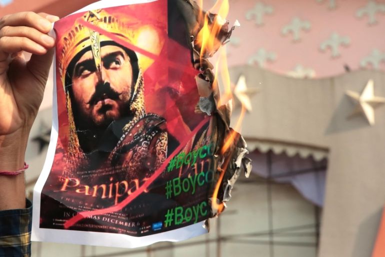Rashtriya Loktantrik Party and members of the Jat community burn posters and protest against the movie Panipat outside Raj Mandir, a prominent city movie theater on December 9, 2019 in Jaipur, India.