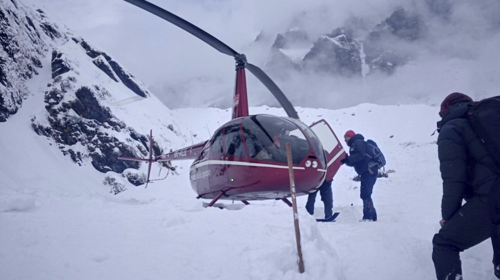 In this photo taken on Saturday, trekkers are rescued by a helicopter a day after the avalanche hit Mount Annapurna trail