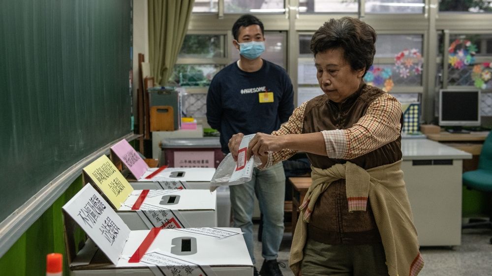 A woman casts her vote in the presidential election in Taipei, Taiwan