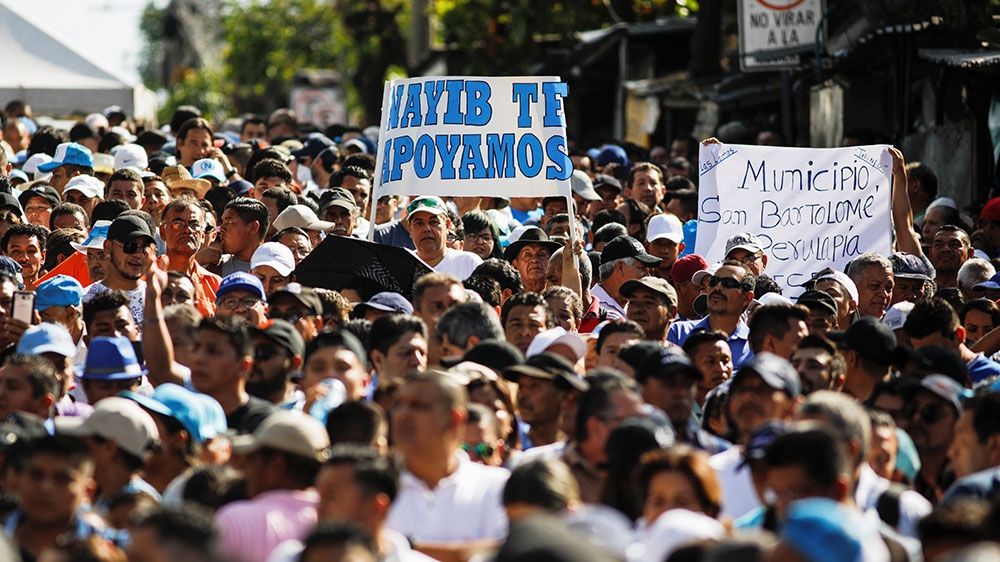 Supporters of Salvadoran President Nayib Bukele protest outside the national congress to push for the approval of funds for a government security plan in San Salvador, El Salvador