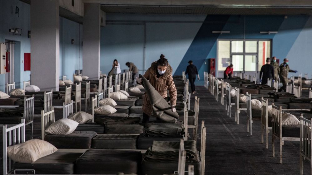Serbian military and volunteers set up beds inside the Novi Sad Fair to accommodate people who suffer mild symptoms of coronavirus disease (COVID-19) in Novi Sad, Serbia