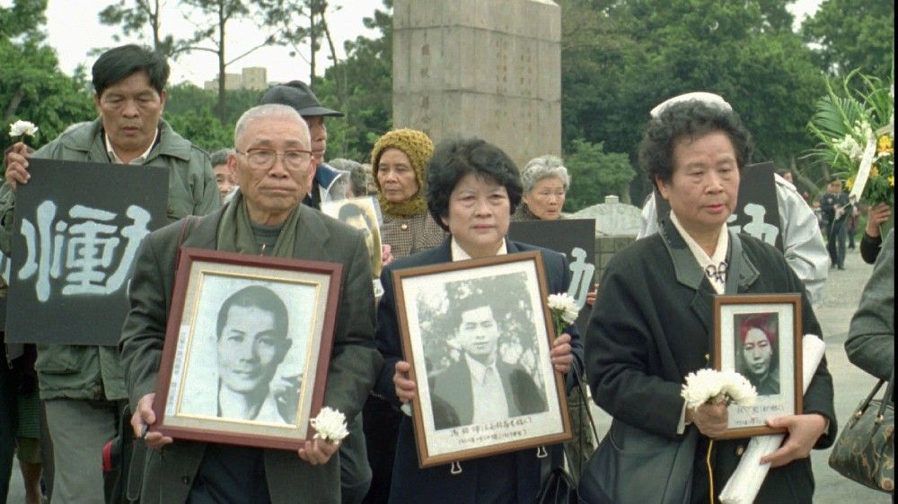 Families hold portraits to commemorate the dead during a memorial service for the victims of Taiwan’s former authoritarian regime back in 1997. Only now are people finding out the truth about what happened during the ‘White Terror’ under former President Chiang Kai-shek