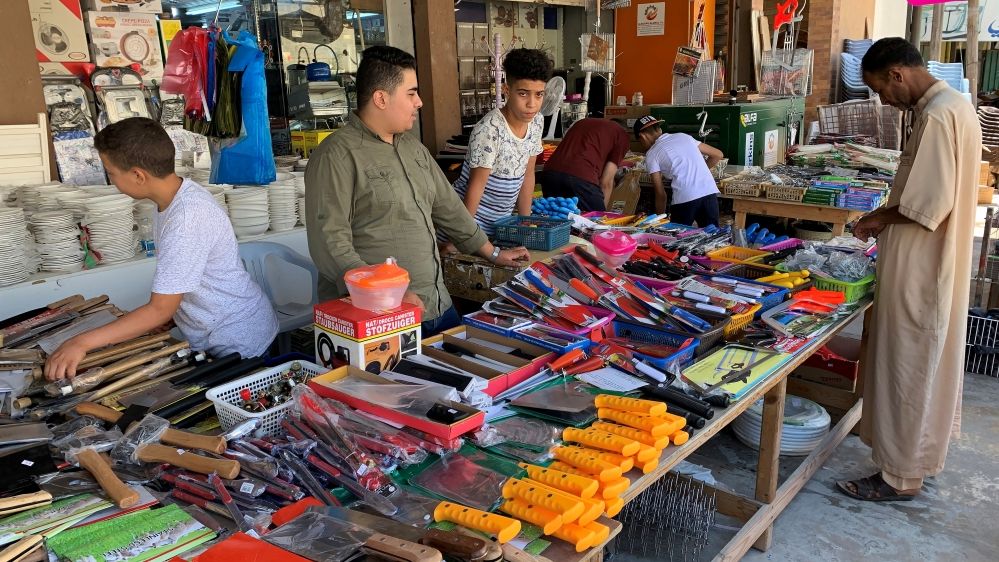 A vendor sells knives at a market in the run-up to the Eid al-Adha celebrations in Misrata