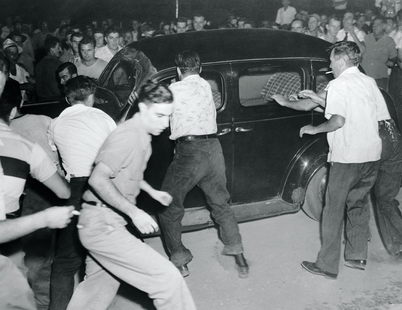 Townspeople blocked cars and hurled rocks and epithets at concertgoers on August 27 in Peekskill; Paul Robeson’s concert would be rescheduled to September 4, when larger riots would break out