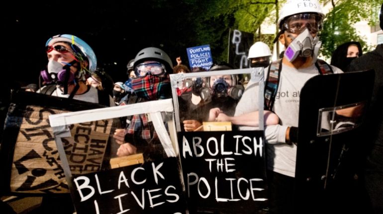 Black Lives Matter protesters march through Portland, Oregon after rallying at the Mark O. Hatfield United States Courthouse in August