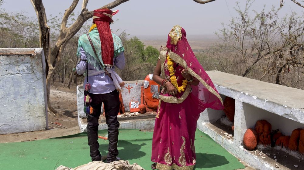 In this April 17, 2017, photograph, a child bride, who is only 14 years old, right, performs rituals with the groom after getting married at a Hindu temple near Rajgarh, India