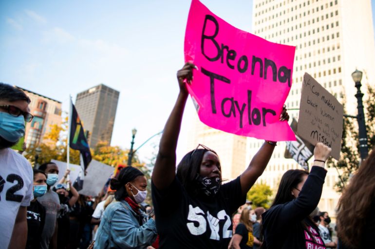 Protesters marching after a grand jury decided not to bring homicide charges against police officers involved in the fatal shooting of Breonna Taylor, in Louisville, Kentucky on September 26, 2020