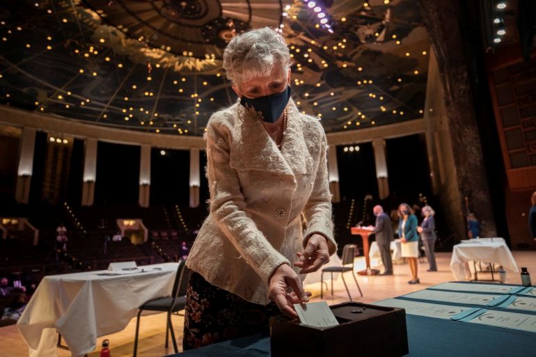 Kathy Dahlkemper of Erie County, parliamentarian of the Electoral College, casts her ballot during the Pennsylvania Electoral College meeting, where the state’s 20 electors voted for Joe Biden for president and Kamala Harris for vice president