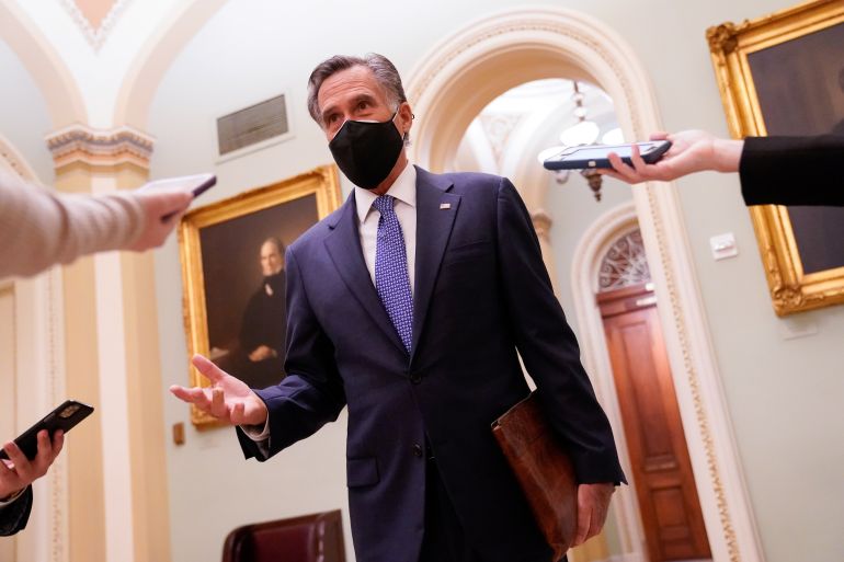 Senator Mitt Romney speaks to reporters in the US Capitol in Washington, DC on December 16, 2020