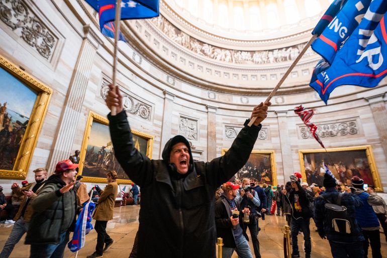 Trump’s supporters in the Capitol Rotunda after breaching Capitol security