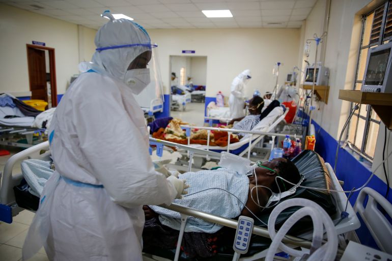 Medical workers attend to coronavirus patients in the intensive care unit of an isolation and treatment centre for those with COVID-19 in Machakos, south of the capital Nairobi, Kenya