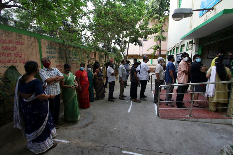 People line up to vote in the Tamil Nadu state assembly elections in Chennai
