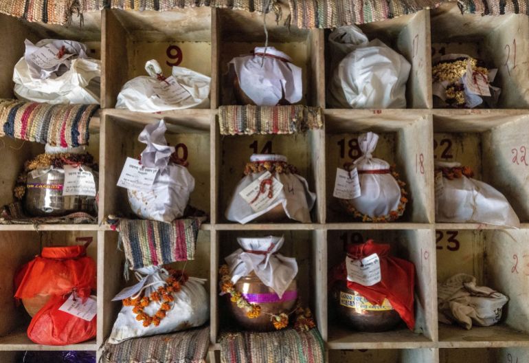 Urns containing ashes after final rites of people including those who died from COVID-19 await immersion due to lockdown at a crematorium in New Delhi