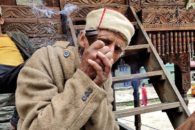 Temple caretaker Chetram smoking his ‘chillum’ (cannabis) in Malana
