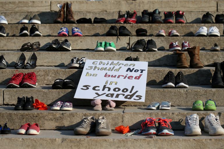 Shoes sit on the steps of the provincial legislature in Winnipeg, Manitoba, following the discovery of the remains of hundreds of children at former residential schools