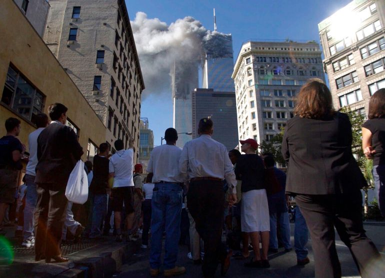Pedestrians in lower Manhattan watched as the World Trade Center burned after being struck by two hijacked aeroplanes. Of the 19 al-Qaeda hijackers, 15 were Saudi nationals