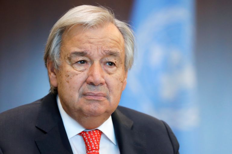 Antonio Guterres looks on