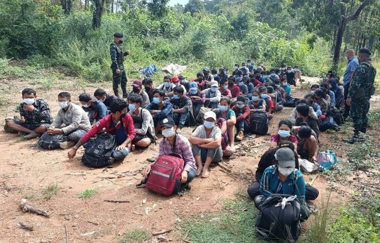 Myanmar refugees were apprehended by Thai military personnel in Kanchanaburi province after they crossed the border on Monday amid ongoing violence [Royal Thai Army Handout Photo via AFP]