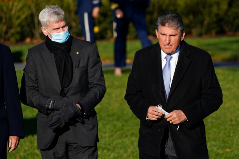 Senator Joe Manchin, right, attended President Joe Biden’s signing of a $1.2 trillion infrastructure bill but has been a roadblock to Biden’s larger $1.75 trillion budget plan