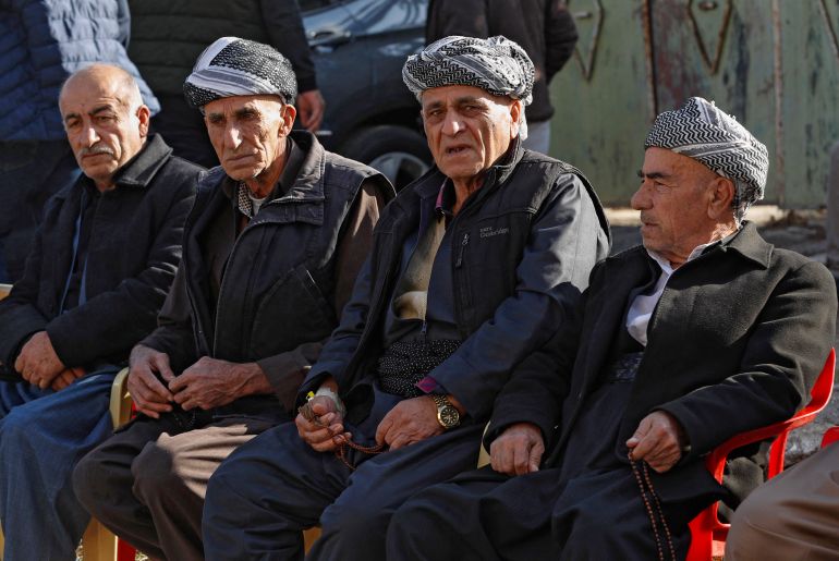 Men attend a condolence ceremony for Iraqi Kurdish Maryam Nuri Hama Amin who drowned in the English Channel