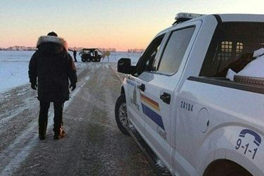 RCMP officers on the scene where four people were found dead near the Canada/US border.