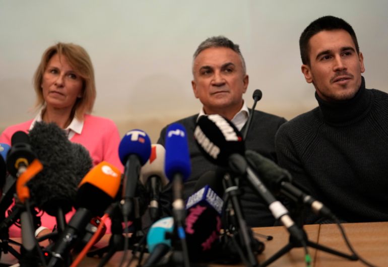 Novak Djokovic’s father Srdjan, centre, brother Djordje, right, and mother Dijana attend a news conference in Belgrade, Serbia