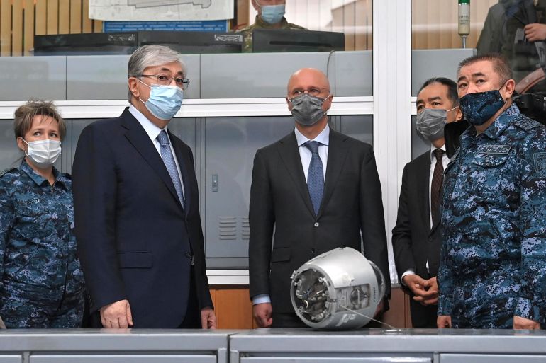 Kazakhstan's President Kassym-Jomart Tokayev, second left, visits the Center for Operational Management of the Police Department in Almaty, Kazakhstan