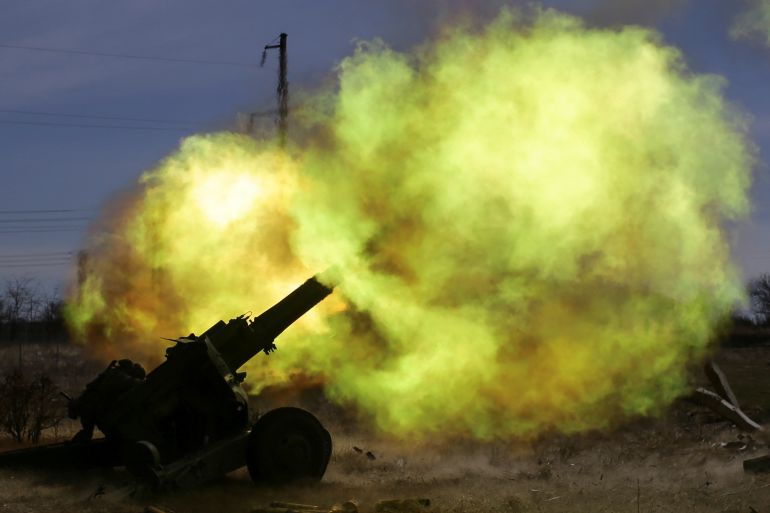 A member of the Ukrainian Volunteer Corps rests next to a howitzer, as Russia's attack on Ukraine continues, at a position in Zaporizhzhia region, Ukraine March 28, 2022.