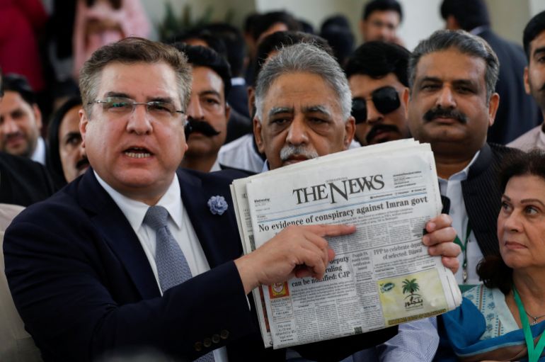 Daniyal Aziz, former minister for privatisation and leader of Pakistan Muslim League-Nawaz (PML-N), displays a newspaper as he speaks to the media at the Supreme Court of Pakistan in Islamabad, Pakistan on April 7, 2022