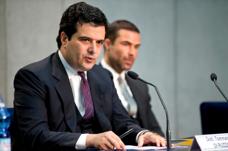 Tommaso Di Ruzza, then director of the Vatican Financial Information Authority, left, flanked by Rene Brulhart, then president of the AIF