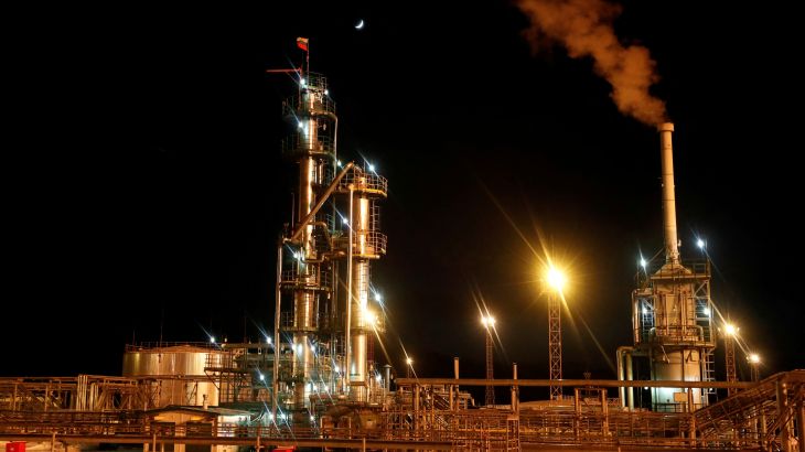 A Russian state flag flies on the top of a diesel plant