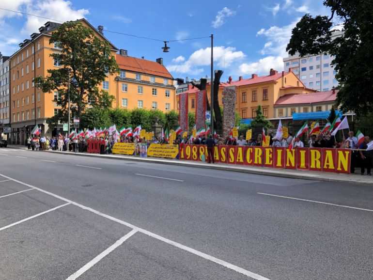 People demonstrate outside the Stockholm District Court
