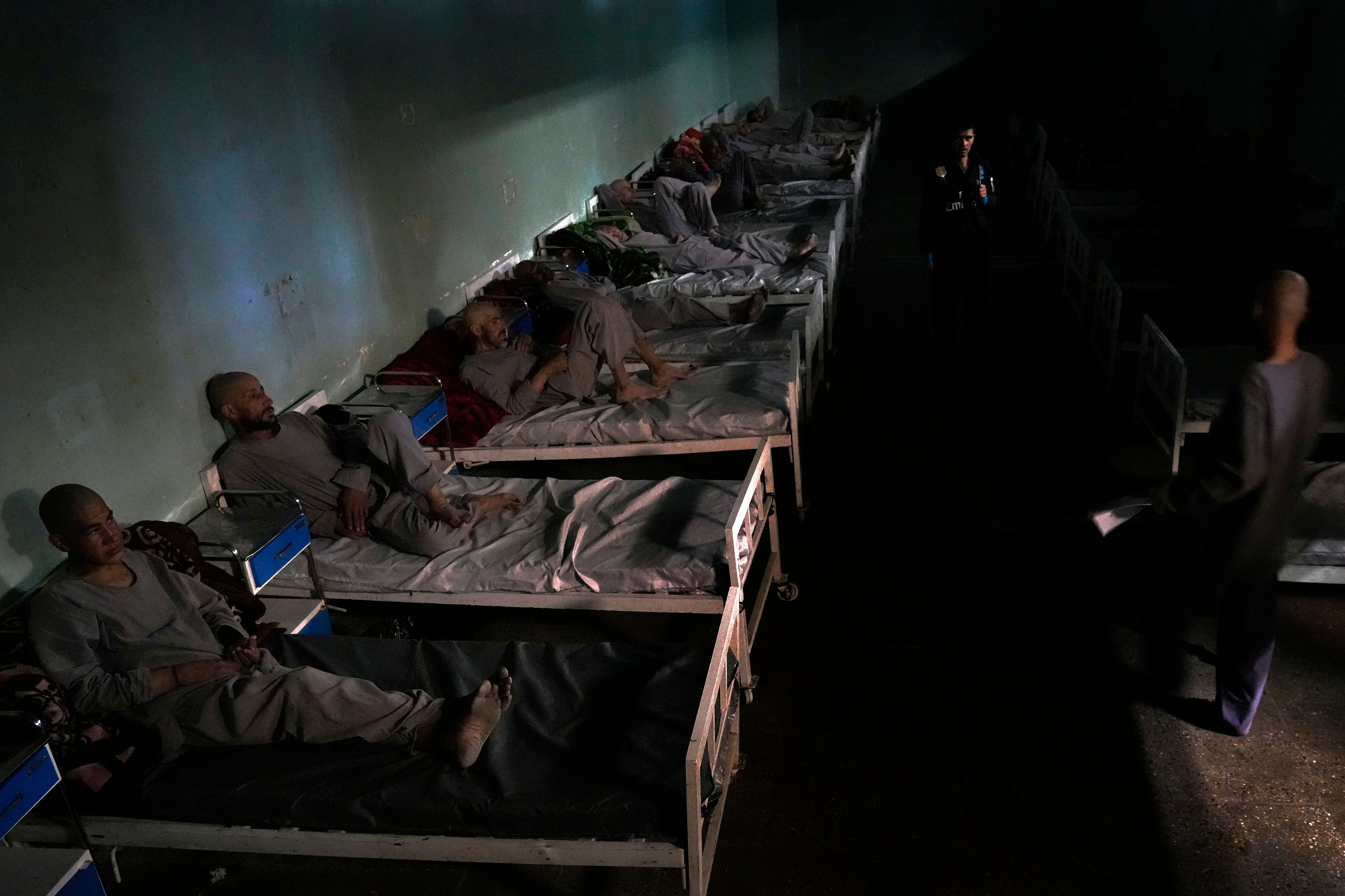 Drug addicts rest on their bed