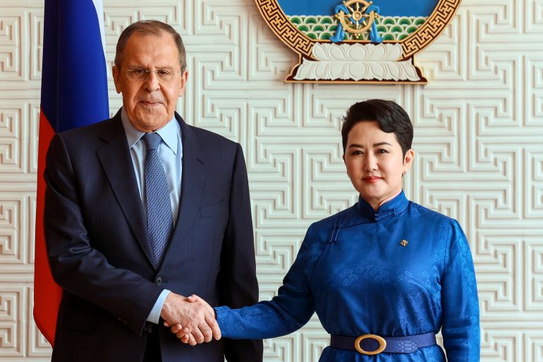 Mongolian Foreign Minister Battsetseg Batmunkh shakes hands with Russian Foreign Minister Sergey Lavrov prior to their talks in Ulaanbaatar, Mongolia, July 5, 2022 [Russian Foreign Ministry Press Service via AP]