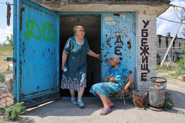 Residents come out of a glass factory bomb shelter in the city of Lysychansk in the Luhansk Region, Ukraine, July 5, 2022