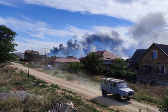 Smoke is seen rising in the Crimean Peninsula following Tuesday's blasts at a Russian air base