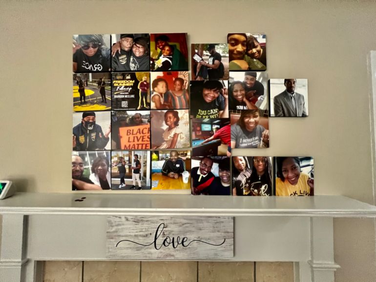 A collage of portraits above the fireplace in Cara and Brandon’s living room
