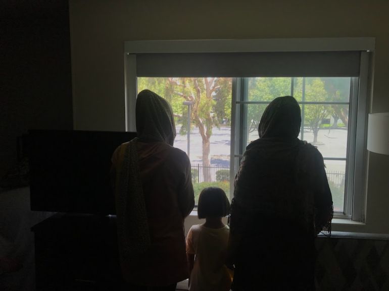 Zarghon stands with some members of her family in a motel in San Jose, California in August. Afghans who resettled in the US after the US withdrawal have struggled with myriad obstacles