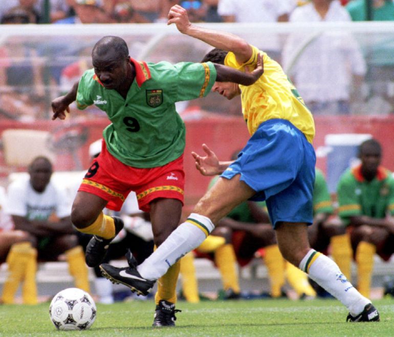 Cameroon's Roger Milla (L)