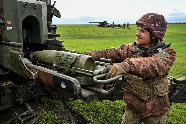 Ukrainian service members prepare to shoot from a towed howitzer FH-70 at a front line, as Russia's attack on Ukraine continues, in Zaporizhzhia Region, Ukraine