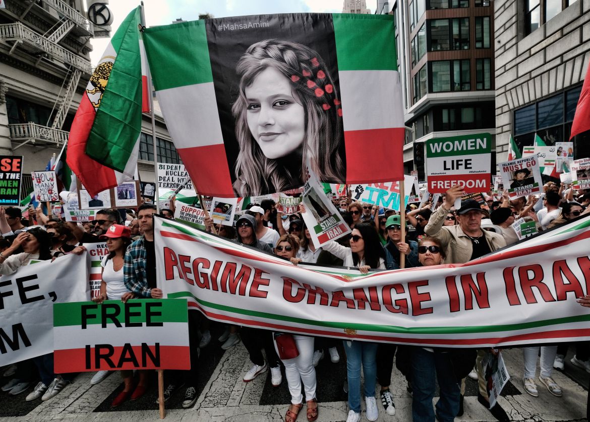 Demonstrators carry a large photo of Mahsa Amini during a protest against the Iranian regime, in Los Angeles.