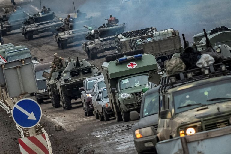 Ukrainian tanks and military vehicles are seen on a road in the Kherson region, Ukraine on November 18, 2022, as Russian attacks have inflicted heav attack on Ukraine continues, REUTERS/Viacheslav Ratynskyi TPX IMAGES OF THE DAY