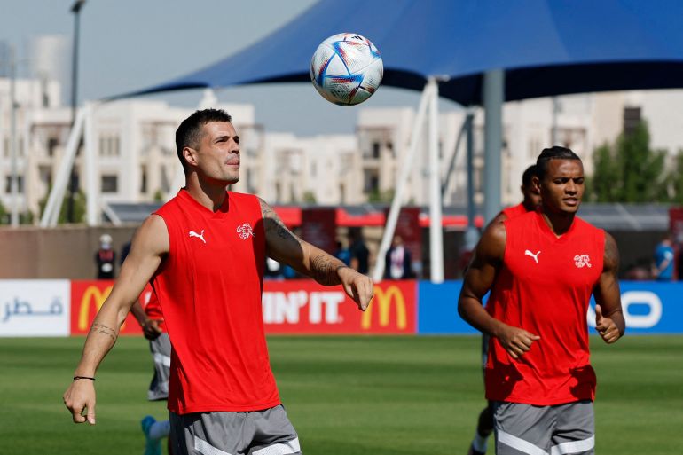 Soccer Football - FIFA World Cup Qatar 2022 - Switzerland Training - University of Doha Training Facilities, Doha, Qatar - November 23, 2022 Switzerland's Granit Xhaka and Manuel Akanji during training REUTERS/Suhaib Salem