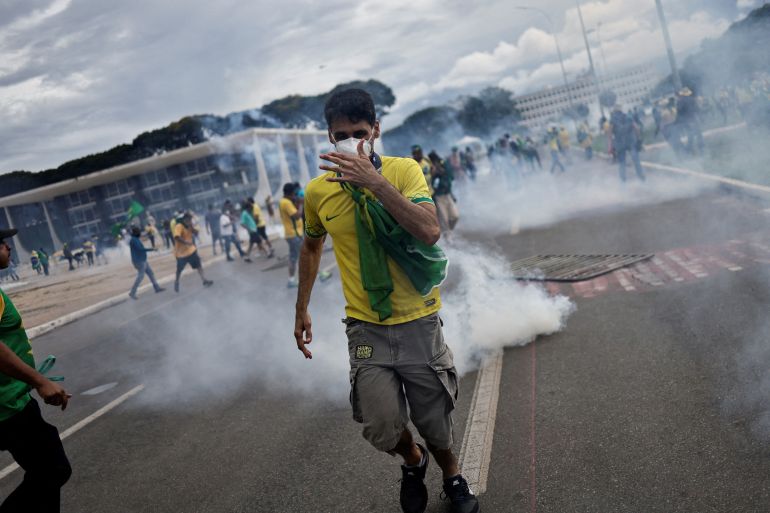 Supporters of Brazil’s former President Jair Bolsonaro demonstrate outside the Planalto Palace in Brasilia on January 8, 2023