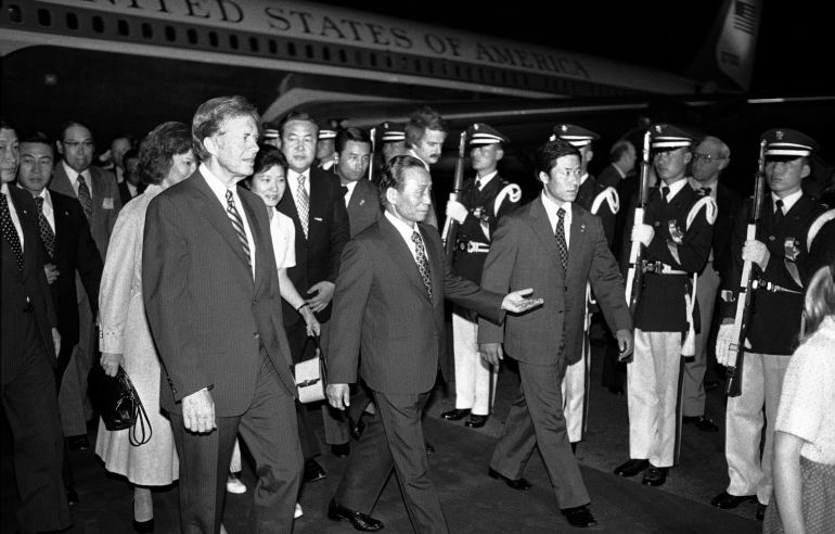South Korean former President Park Chung-hee (centre) cited the threat from North Korea to suspend civil and political rights