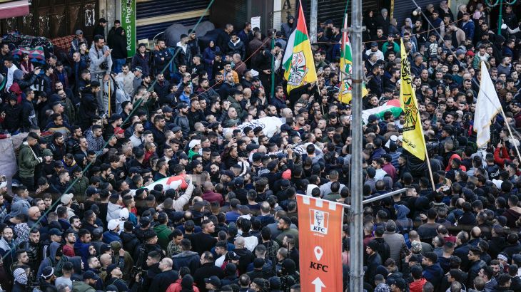 Palestinians carry the bodies of men killed in clashes with Israel troops in the West Bank city of Nablus